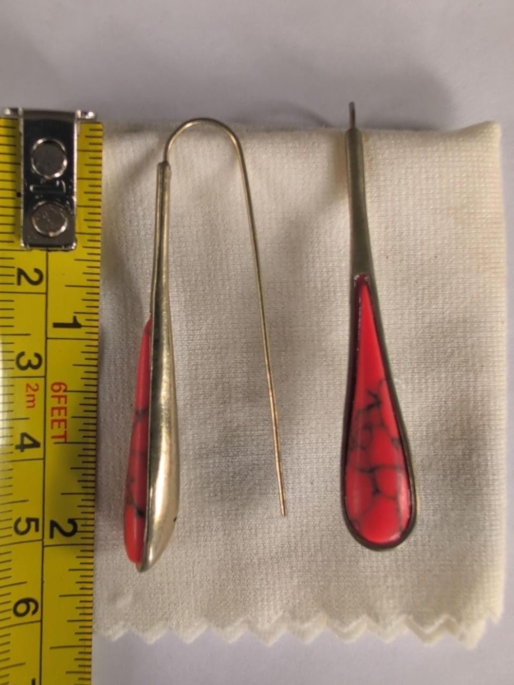 Kenneth Cole silver-tone, Red stone teardrop dangle earrings.